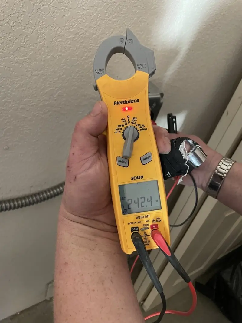 Voltage testing with clamp meter during Whole House Surge Protector in Etna